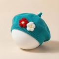 Detail of teal knit beret for girls featuring handmade 3D floral accents and soft texture - Sapphire Blue