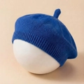 Close-up of Klein Blue knitted baby beret with a soft texture and top handle detail - Blue
