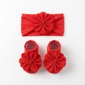 Detailed view of red baby headband and socks set with large decorative fabric flowers - Red