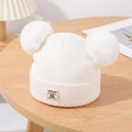 White knitted baby beanie with double faux fur pom-poms and warm ribbed texture - White