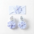 Detail of white infant headband and socks with delicate lavender floral fabric decorations - White