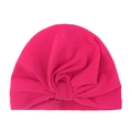 Detailed view of magenta knot detail on soft knit cotton Indian style baby turban cap - Rose Red