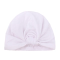 Detail view of soft white cotton baby turban hat with a classic knotted bow design - White