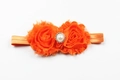 Détail du bandeau bébé en mousseline orange avec boucle centrale en perle et strass - Orange
