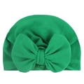 Detailed close-up of emerald green baby turban hat with a large decorative bow - Green