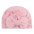 Close-up of pink soft knit baby turban hat with a large decorative bow and ribbed texture - Pink