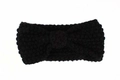 Detail of black chunky knit baby headband with central bow knot and textured weave pattern - Black