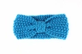 Close-up of bright blue chunky knit baby headband with a decorative bow knot detail - Blue