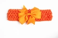 Vibrant orange baby headband with a large ribbed bow and elastic knit wide band - Orange