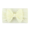 Soft cream nylon baby headband featuring a large bow for toddlers and infants - Beige