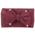 Detailed macro view of deep red ribbed knit baby headband with bow and pearls - Burgundy