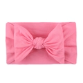 Soft nylon elastic headband for infants featuring a large bright pink fabric bow knot - Pink