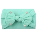 Detail of mint green nylon baby headband with soft texture and pearl-studded bow ornament - Mint Green