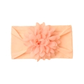 Close-up of peach nylon baby headband showing soft fabric texture and large fabric flower - Flesh Pink