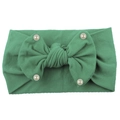Detail of dark green nylon baby headband with soft knit texture and pearl bow accents - Green
