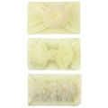 Detailed view of three soft nylon baby headbands in light yellow with bow and floral knots - Beige