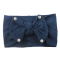 Detail of navy blue nylon baby headband with a large soft bow and white pearl accents - Navy Blue