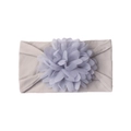 Detail showing a soft grey nylon baby headband with a large purple chiffon flower deco - Gray