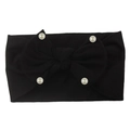 Detail view of soft black nylon baby headband with a large bow and four white pearls - Black