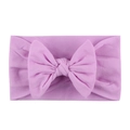 Soft nylon baby headband featuring a large light purple bow for infants and toddlers - Purple