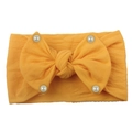 Elastic baby headband with a large yellow bow and white faux pearls in soft knit fabric - Earthy Yellow