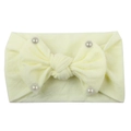 Soft cream yellow nylon baby headband featuring a large bow decorated with faux pearls - Beige