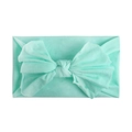 Detail of soft mint green nylon baby headband with large elastic bow decoration - Mint Green