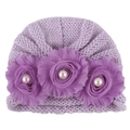 Detailed texture of purple knitted baby hat with chiffon flowers and white faux pearls - One Size / Purple