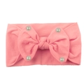 Pink elastic nylon baby headband featuring a large bow and white pearl accents - Pink