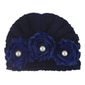 Detail of dark blue knit baby hat featuring ruffled texture and three fabric roses with pearls - One Size / Navy Blue