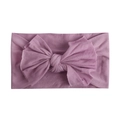 Close-up of soft lavender nylon baby headband with a large handmade bow detail - Taro
