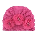 Detailed macro view of pink knitted baby hat with soft chiffon flowers and pearl accents - One Size / Rose Red