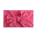 Close-up of pink soft nylon headband featuring a large handmade knot bow for infants - Rose Red