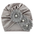 Detailed macro of silver grey velvet baby turban hat with decorative fabric roses and pearls - One Size / Gray