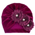 Detail of soft purple velvet baby turban with three handmade fabric roses and white pearls - One Size / Fuschia