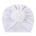 Detail view of a white baby turban hat with a large 3D fabric rose flower decoration - White