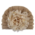 Detailed view of baby knit hat with khaki cable texture and golden polka dot mesh flower - Coffee