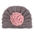 Close-up of baby turban hat featuring a grey knit texture and pink satin rose flower - Gray