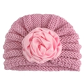 Detail of baby pink knit hat featuring a large satin rose flower for warm winter wear - Pink