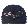 Detail of baby knitted turban hat in navy blue with a floral print bow knot decoration - Navy Blue