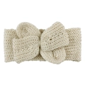 Vue détaillée d'un bandeau en maille blanc crème pour bébé avec un grand nœud texturé doux - Beige