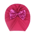 Close-up of rose red baby turban hat with a shiny sequined bow on soft knit fabric - Rose Red