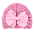 Close-up of deep pink knitted baby turban hat with a large light pink satin bow detail - Pink