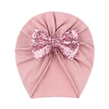 Detail of baby pink turban hat with a large sparkling sequined bow on soft knit fabric - Dusky Pink