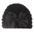 Detailed view of black knitted baby turban hat with a large decorative bow - Black