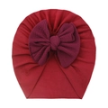 Close-up of deep red waffle textured giant bow on a soft infant turban hat - Burgundy