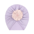 Detail of lavender baby beanie featuring a large pink layered fabric flower and beads - Purple