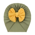 Detail of baby turban hat showing grass green ribbed fabric and yellow waffle bow - Dark Green