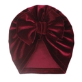 Detail of burgundy velvet baby turban hat with a large bow showing smooth texture - One Size / Burgundy