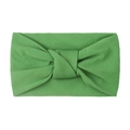 Close-up of grass green knotted nylon headband showing high elasticity and soft texture - Green